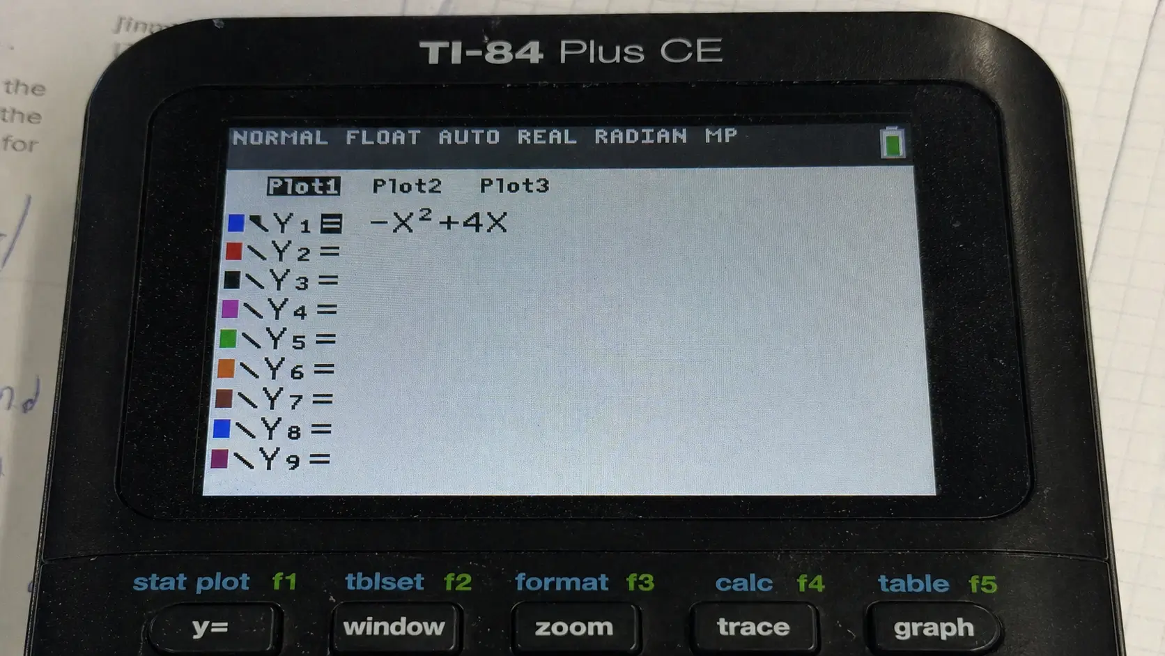 Pressing the Y equals button and entering a function on TI-84