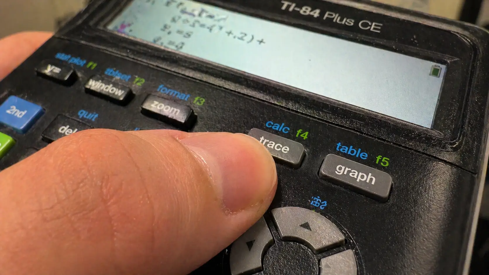 Pressing 2nd TRACE to open the Calculate menu on TI-84